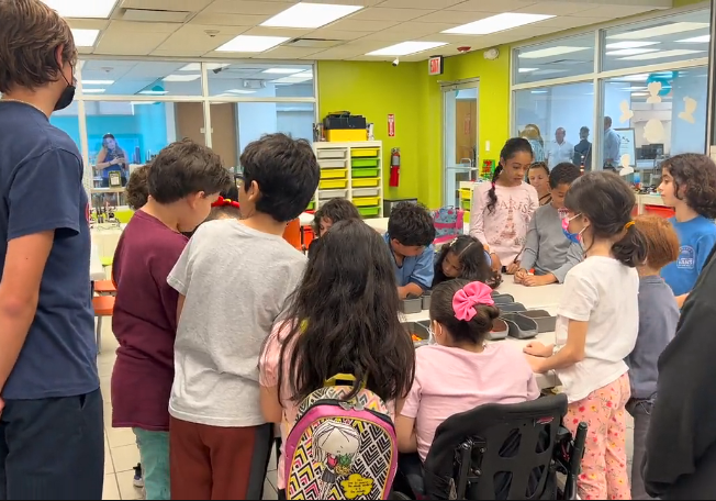 A group of children building Legos